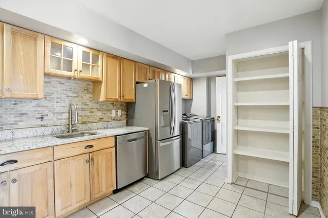 a room with a window and chandelier