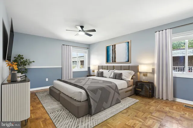 a kitchen with granite countertop white cabinets white stainless steel appliances and a refrigerator