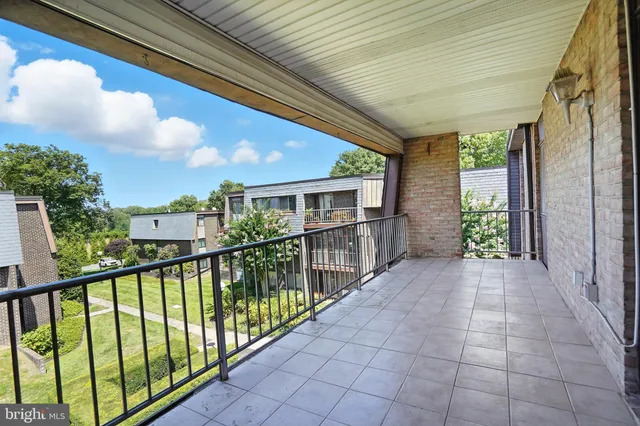 a bathroom with a toilet a sink a mirror a bathtub and shower