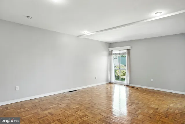 a view of an empty room and window