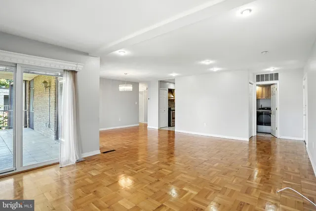 a sign board with buildings in the background