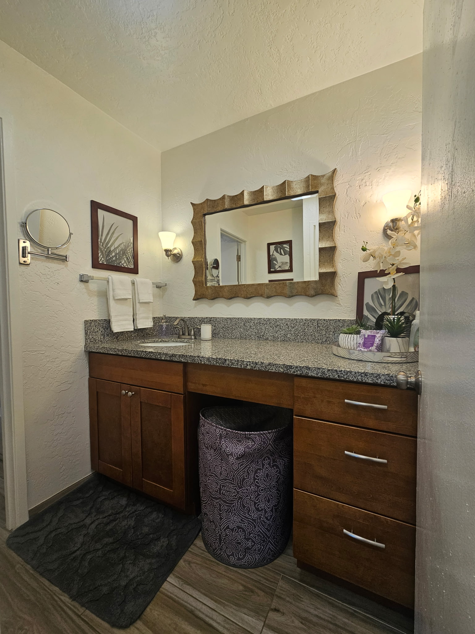 525 Aleka Loop, Unit D3 Kapaa, HI 96746 - Photo 12 of 13 a bathroom with a granite countertop sink and a mirror
