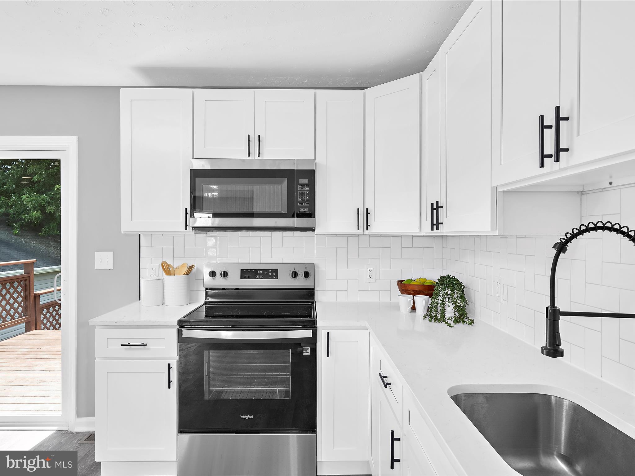 74 Ayers Drive Rising Sun, MD 21911 - Photo 11 of 41 a kitchen with granite countertop a sink stainless steel appliances and cabinets