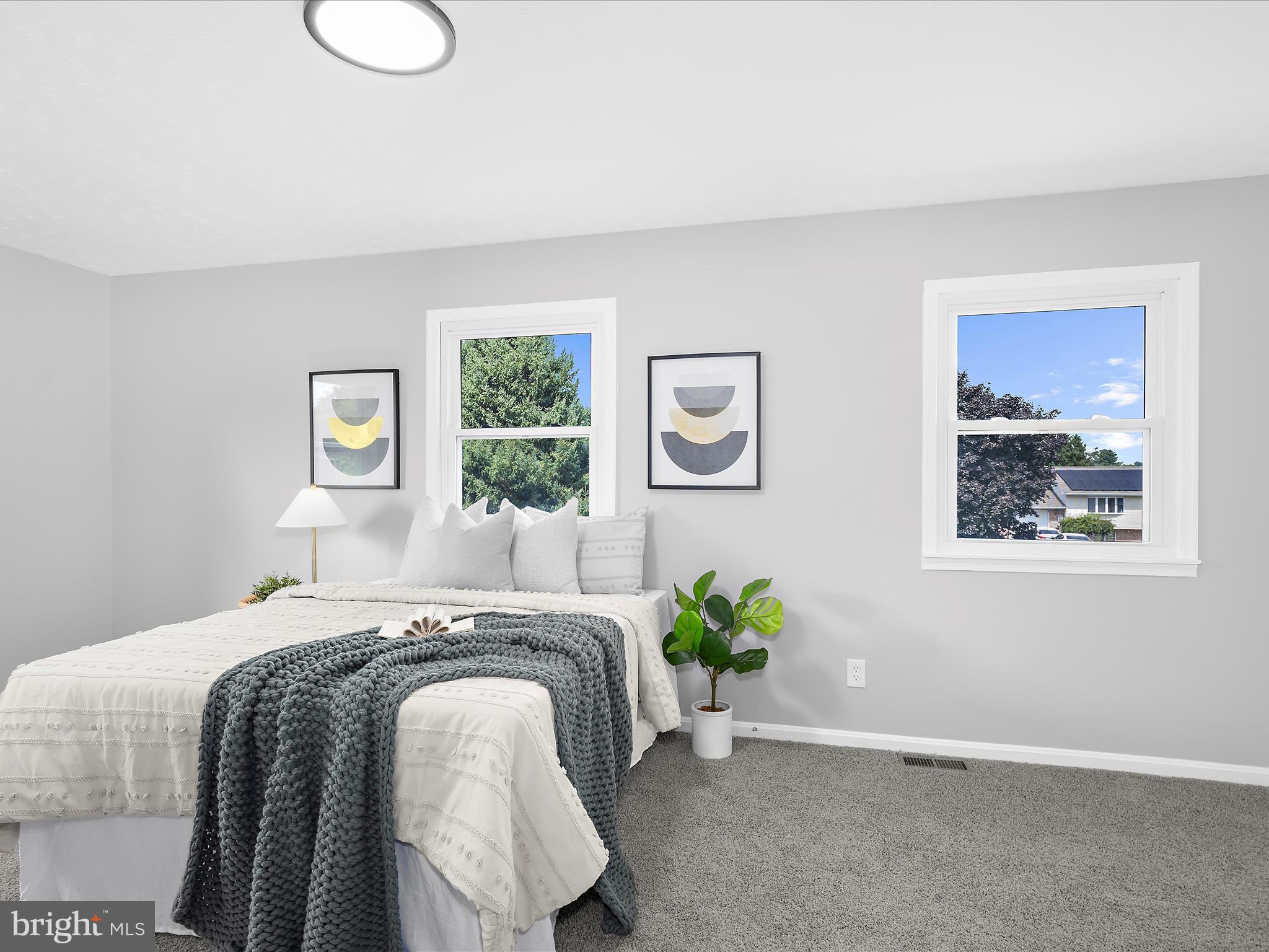 74 Ayers Drive Rising Sun, MD 21911 - Photo 18 of 41 a bed sitting in a bedroom next to a window