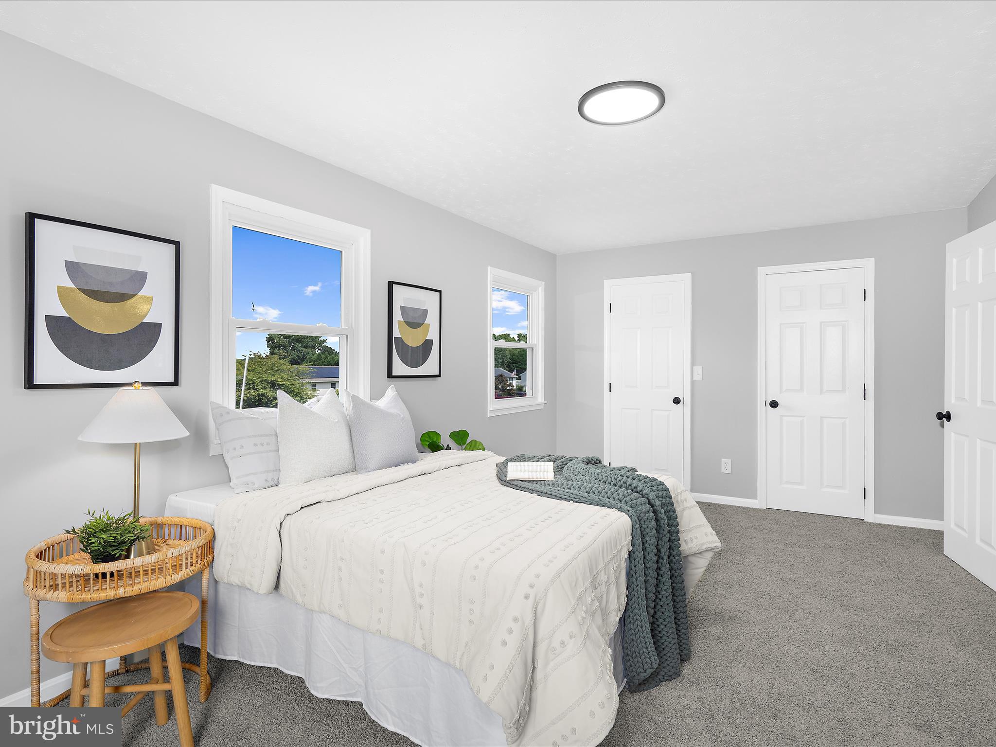 74 Ayers Drive Rising Sun, MD 21911 - Photo 19 of 41 a bedroom with a bed and a chandelier