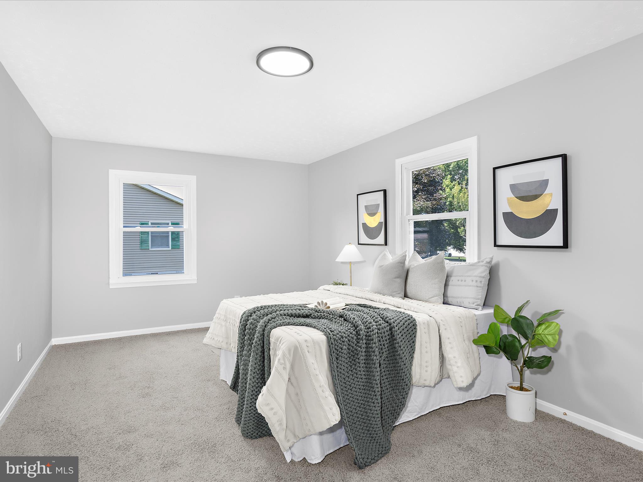 74 Ayers Drive Rising Sun, MD 21911 - Photo 20 of 41 a bedroom with a bed and painting on the wall