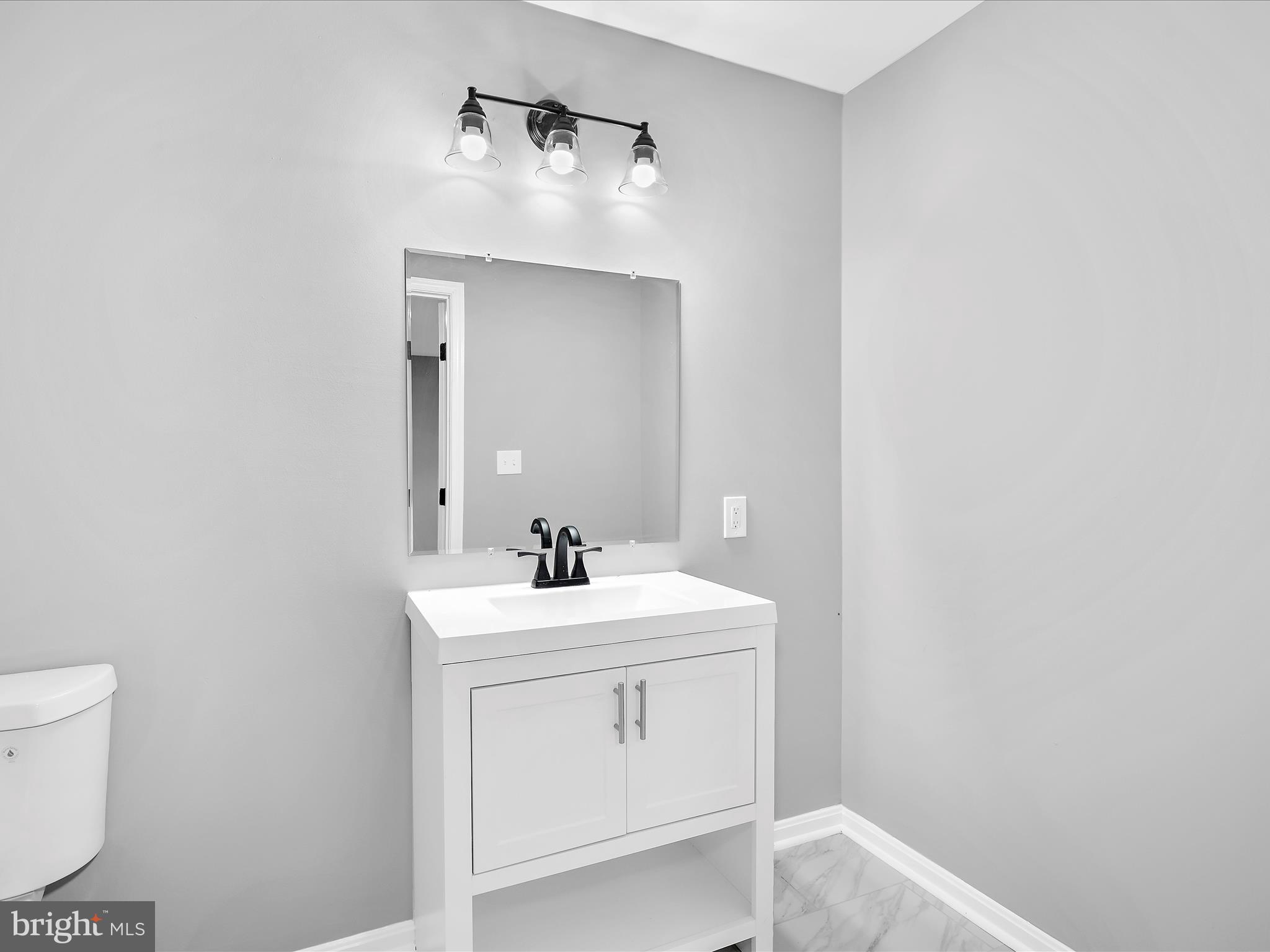 74 Ayers Drive Rising Sun, MD 21911 - Photo 24 of 41 a bathroom with a sink a toilet and mirror