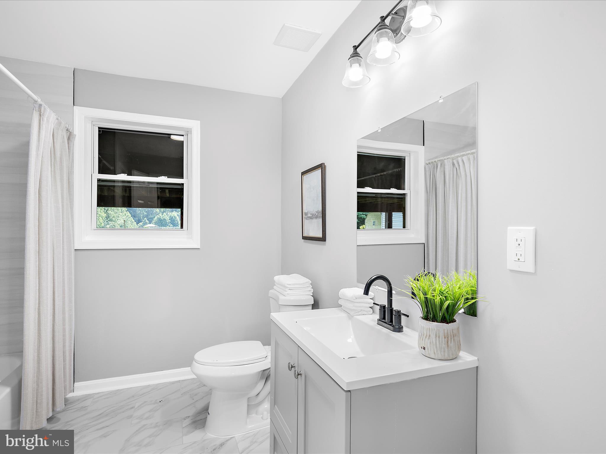 74 Ayers Drive Rising Sun, MD 21911 - Photo 27 of 41 a bathroom with a toilet sink and mirror