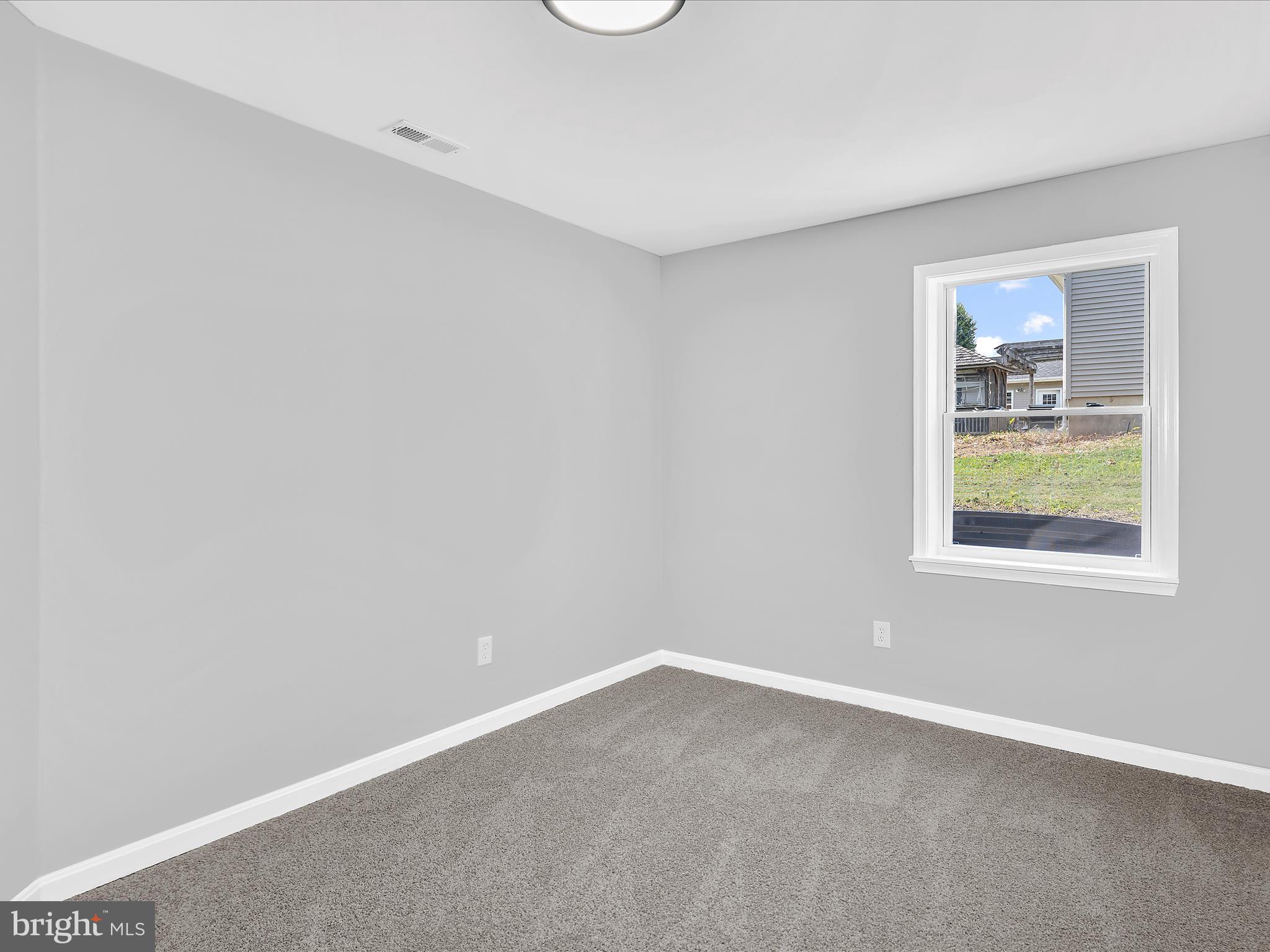 74 Ayers Drive Rising Sun, MD 21911 - Photo 29 of 41 an empty room with windows and entrance