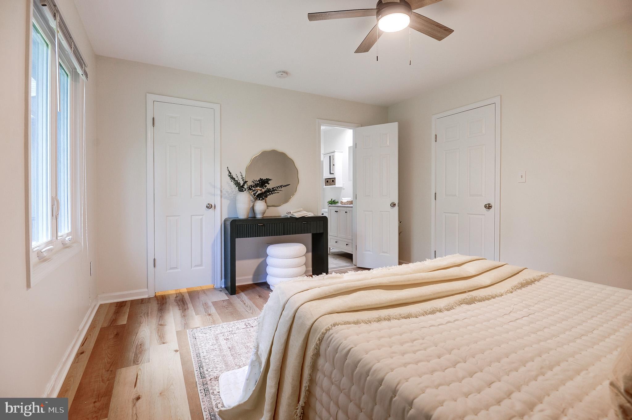 10116 Evans Ford Road Manassas, VA 20111 - Photo 29 of 63 a bedroom with a bed and a chandelier