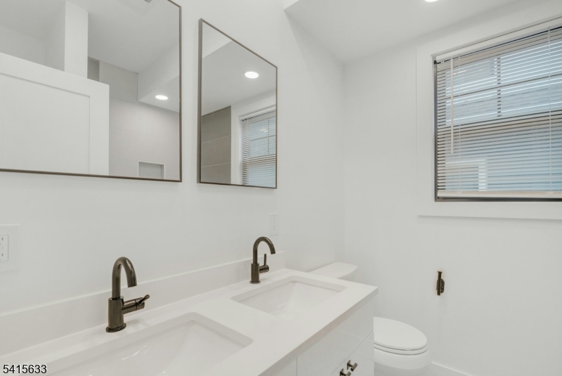 71 Mission Street, Unit 2 Montclair, NJ 07042 - Photo 13 of 25 a bathroom with a sink and a toilet