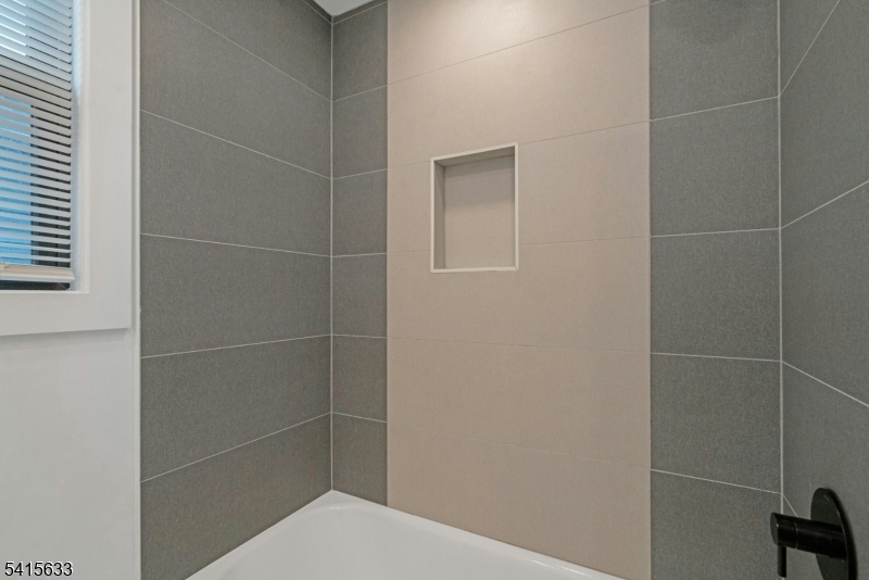 71 Mission Street, Unit 2 Montclair, NJ 07042 - Photo 14 of 25 a bathroom with a toilet and a shower