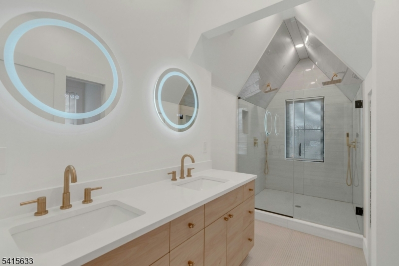 71 Mission Street, Unit 2 Montclair, NJ 07042 - Photo 18 of 25 a bathroom with a sink and a mirror