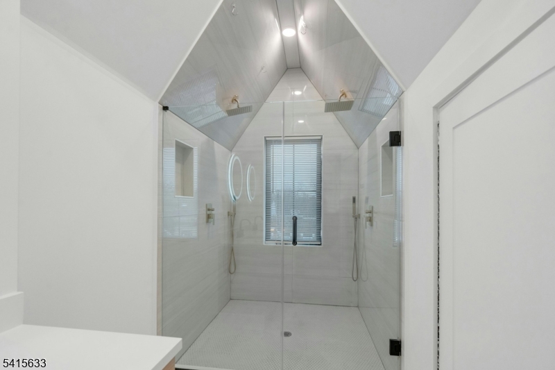 71 Mission Street, Unit 2 Montclair, NJ 07042 - Photo 19 of 25 a bathroom with a shower and vanity