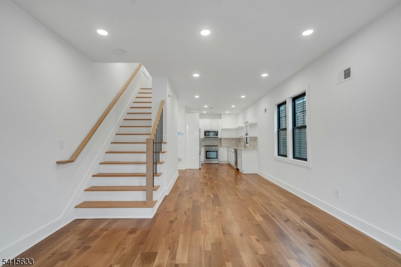 71 Mission Street, Unit 2 Montclair, NJ 07042 - Photo 2 of 25 a view of kitchen and hall with wooden floor