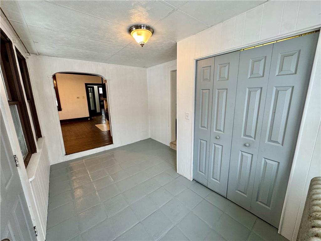 218 Clifford Avenue Apollo, PA 15613 - Photo 14 of 32 a view of a hallway with wooden floor and stairs