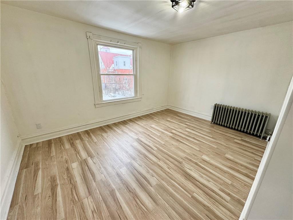 218 Clifford Avenue Apollo, PA 15613 - Photo 20 of 32 wooden floor in an empty room with a window