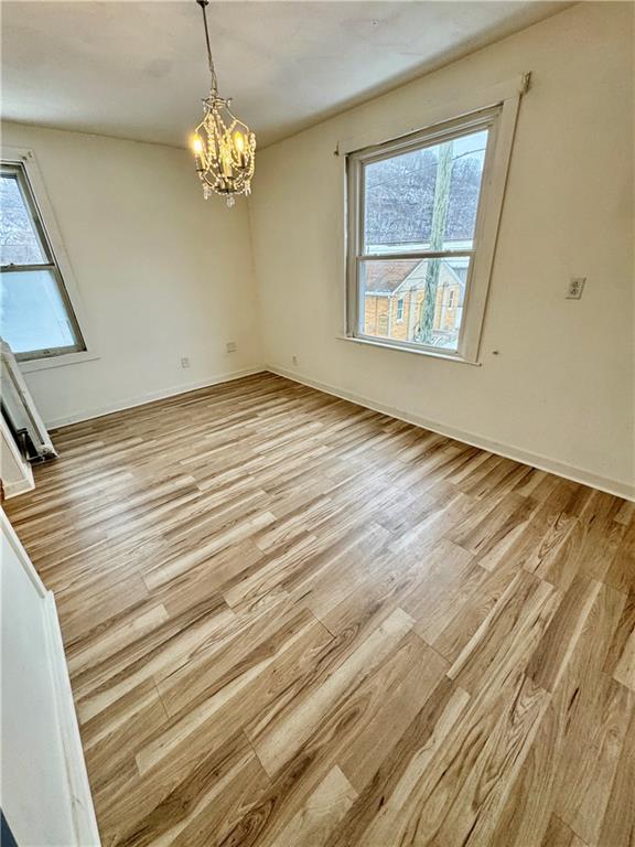 218 Clifford Avenue Apollo, PA 15613 - Photo 24 of 32 a view of empty room with wooden floor and fan