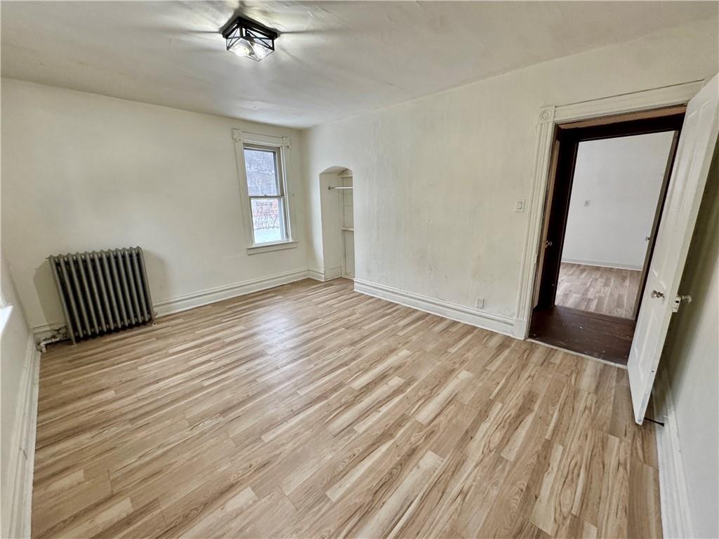 218 Clifford Avenue Apollo, PA 15613 - Photo 26 of 32 a view of an empty room with wooden floor and a window