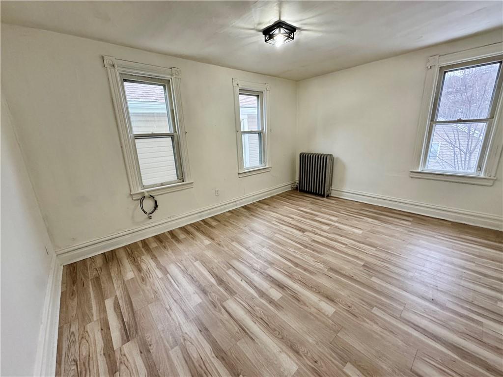 218 Clifford Avenue Apollo, PA 15613 - Photo 27 of 32 a view of an empty room with wooden floor and a window