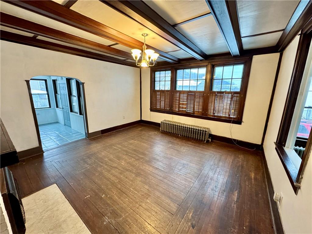 218 Clifford Avenue Apollo, PA 15613 - Photo 5 of 32 a view of an empty room with wooden floor and door