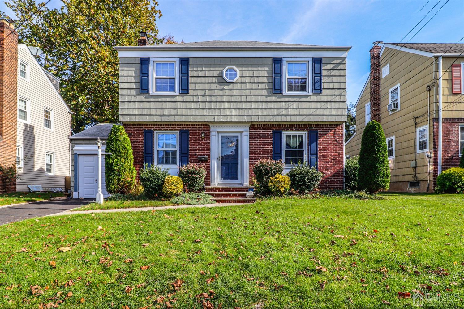 485 Whitewood Road Union, NJ 07083 - Photo 1 of 24 a front view of a house with yard and green space