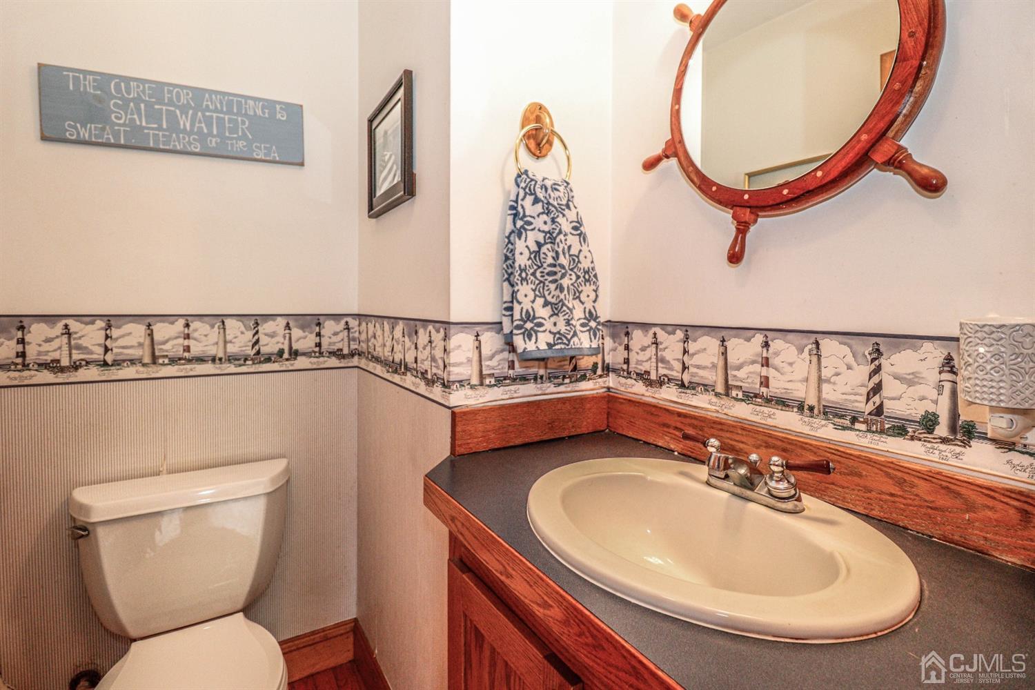 485 Whitewood Road Union, NJ 07083 - Photo 12 of 24 a bathroom with a sink and a mirror