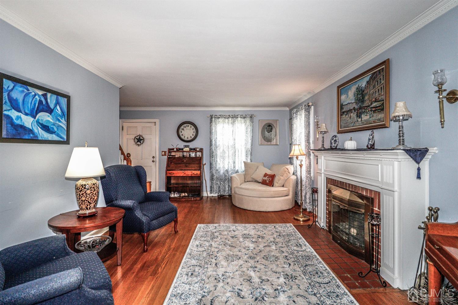 485 Whitewood Road Union, NJ 07083 - Photo 13 of 24 a living room with furniture and a fireplace