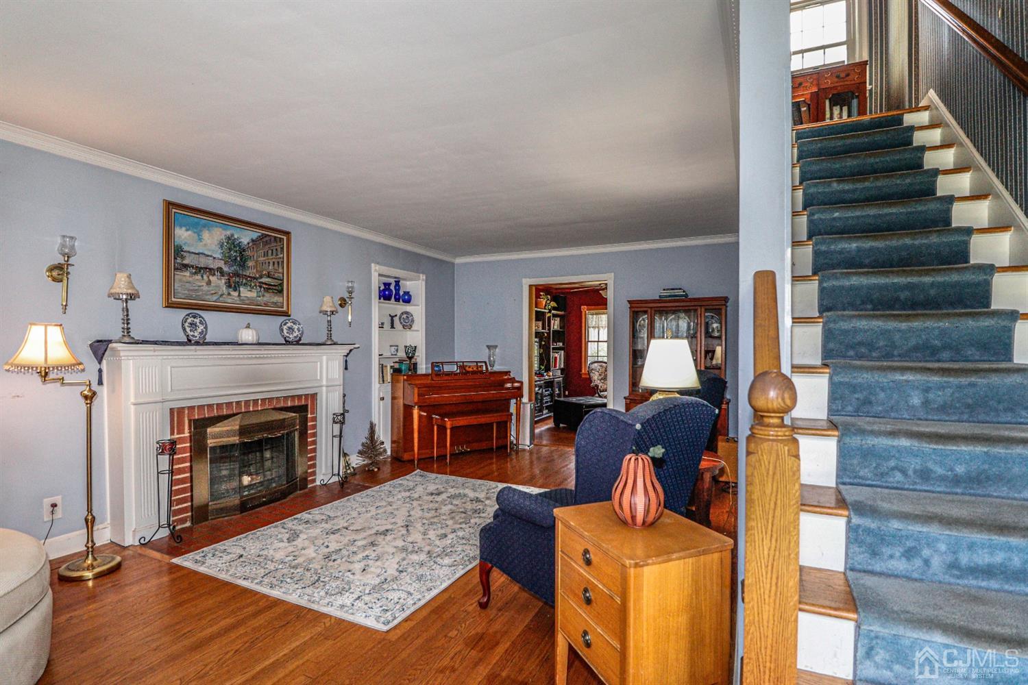 485 Whitewood Road Union, NJ 07083 - Photo 15 of 24 a living room with furniture and a fireplace