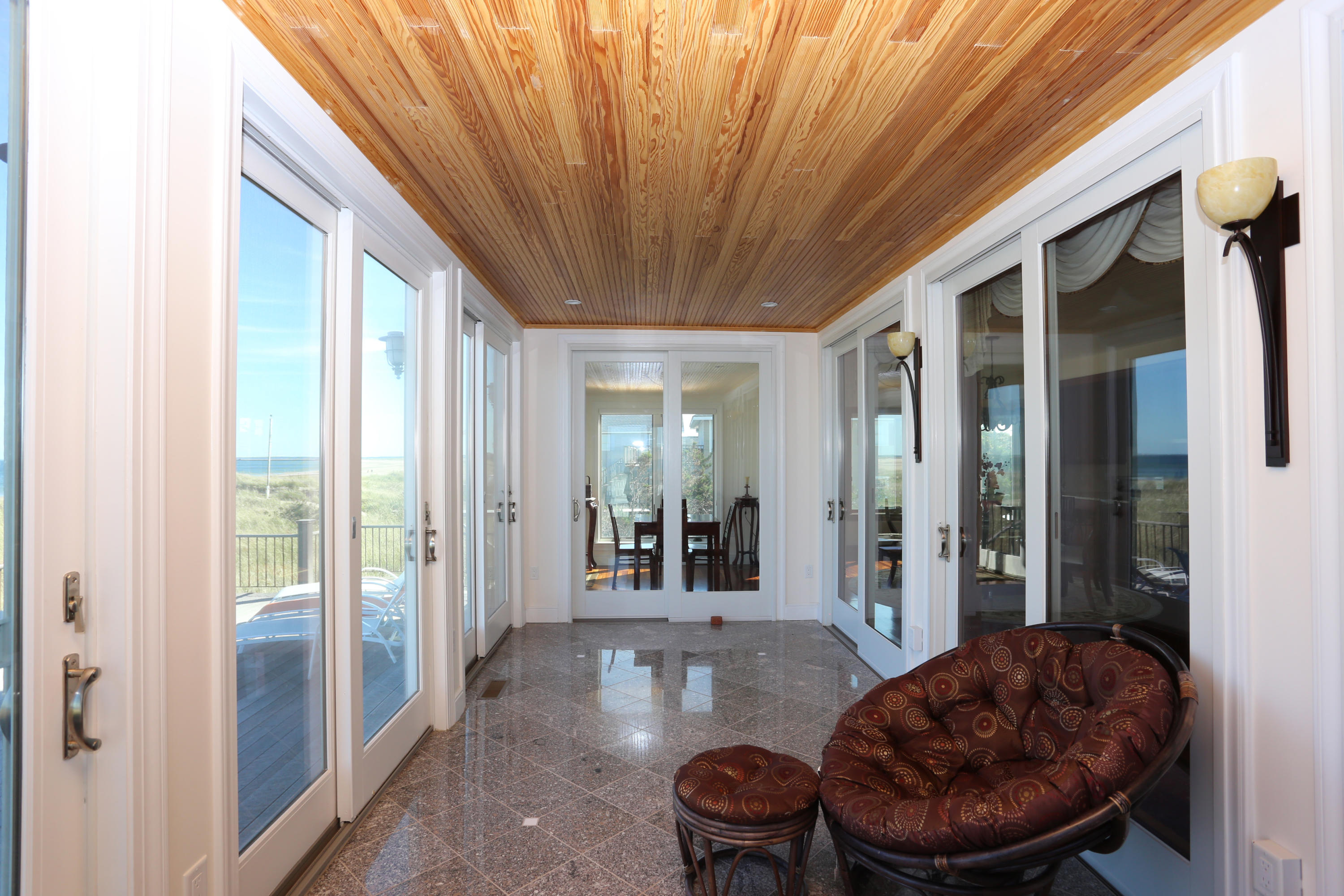 99 Phillips Road Sagamore Beach, MA 02562 - Photo 11 of 30 a living room with furniture and a large window