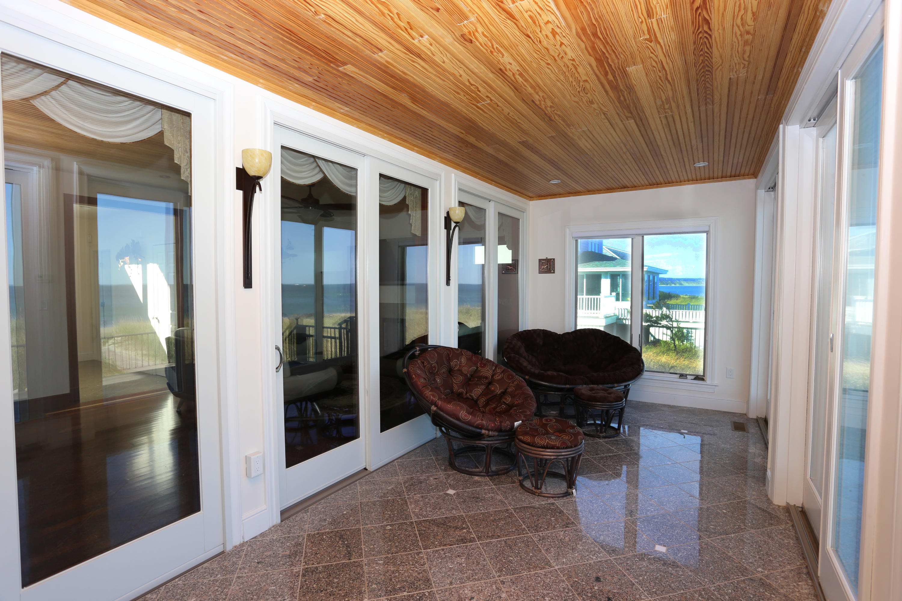 99 Phillips Road Sagamore Beach, MA 02562 - Photo 12 of 30 a living room with furniture and large windows