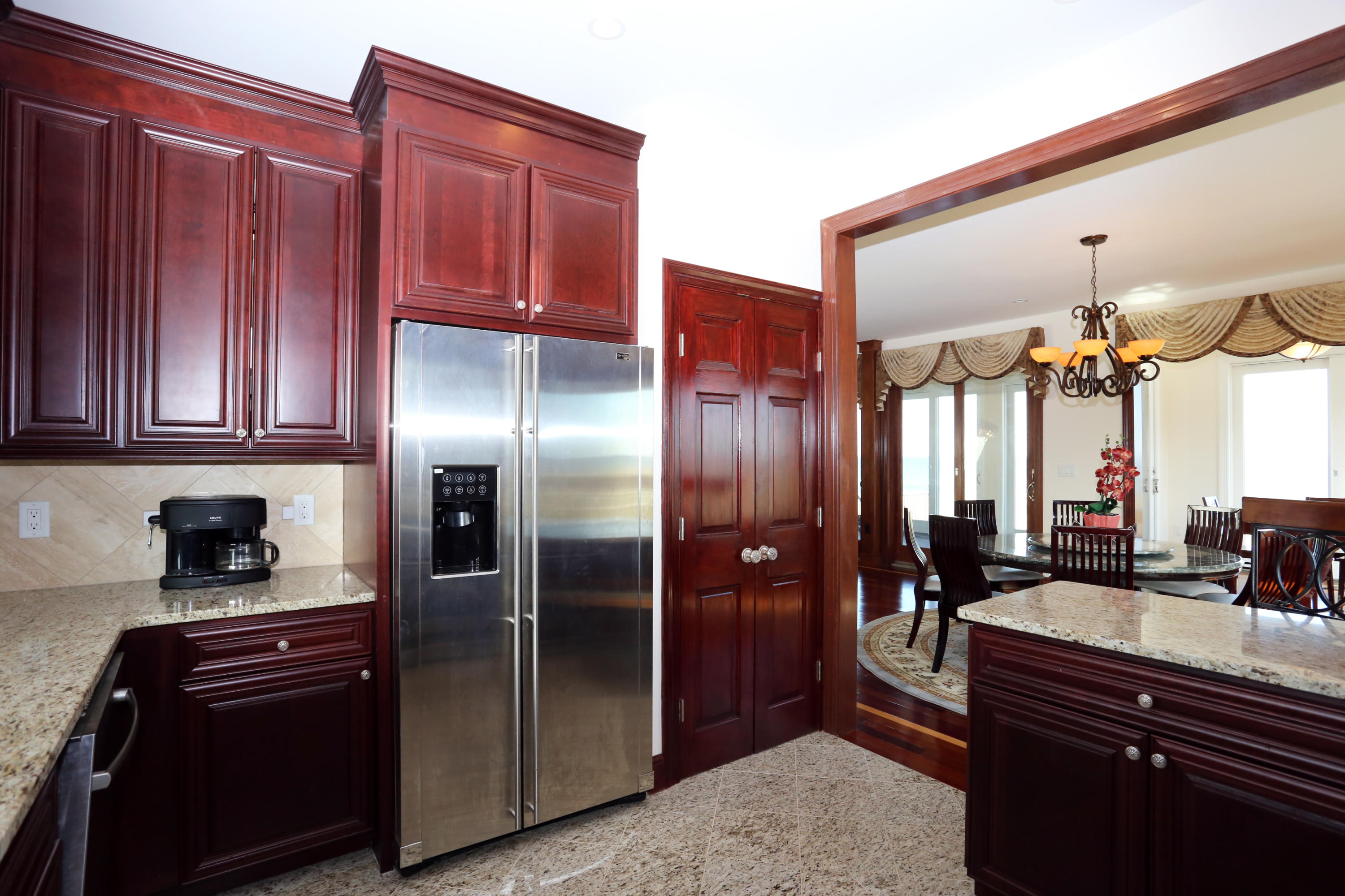 99 Phillips Road Sagamore Beach, MA 02562 - Photo 18 of 30 a kitchen with stainless steel appliances granite countertop a refrigerator and a sink