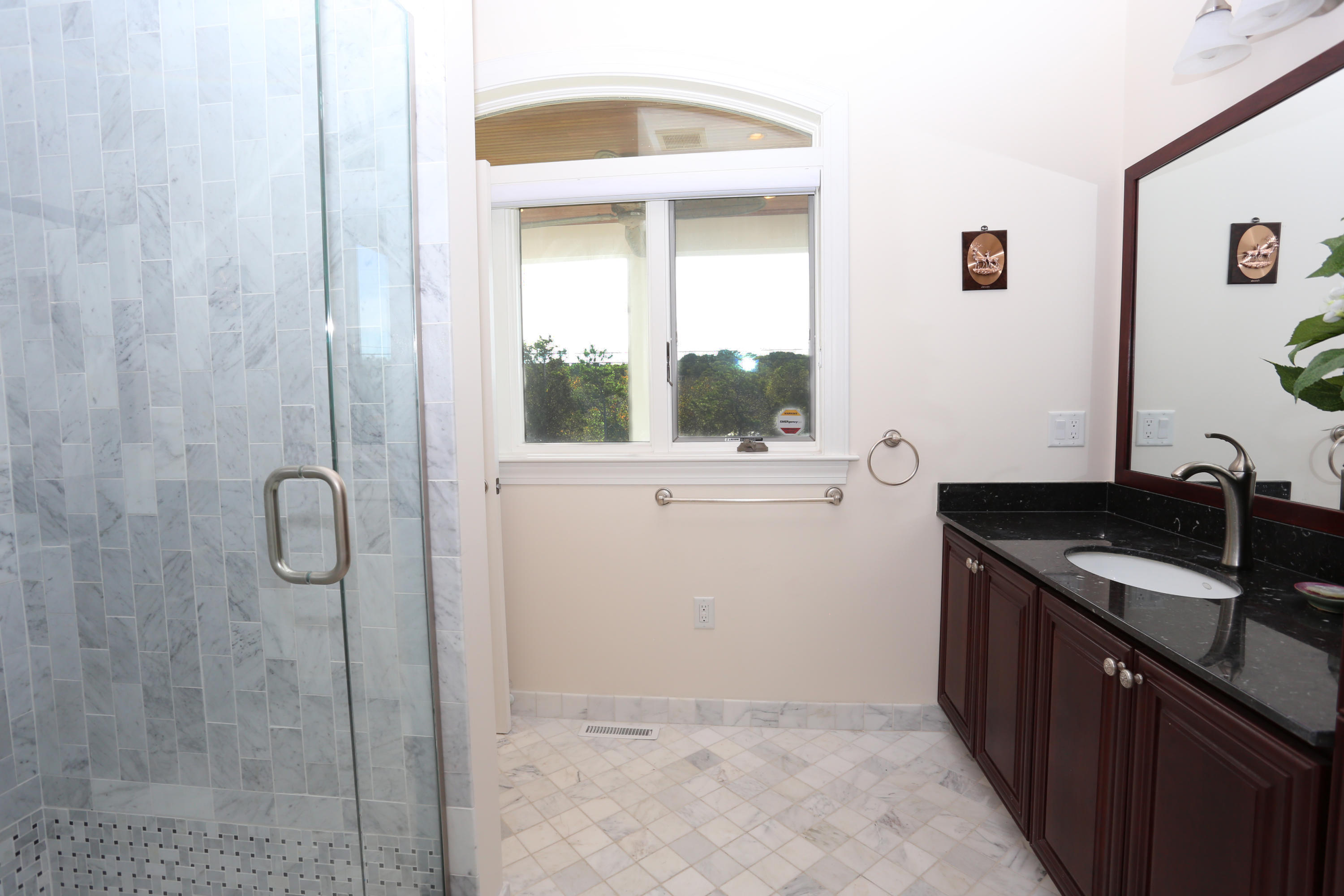 99 Phillips Road Sagamore Beach, MA 02562 - Photo 23 of 30 a kitchen with a sink and a mirror