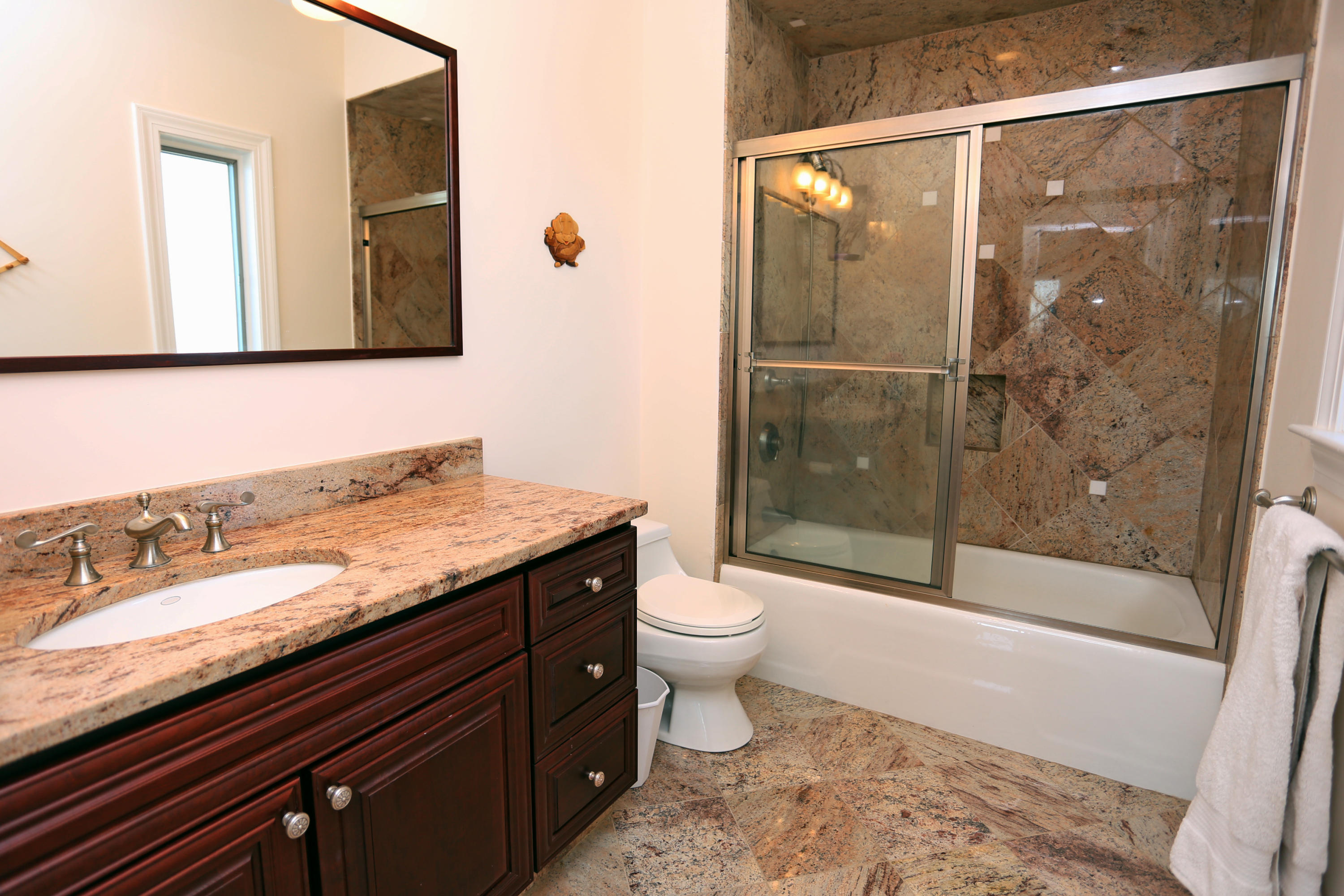 99 Phillips Road Sagamore Beach, MA 02562 - Photo 26 of 30 a bathroom with a granite countertop sink toilet and shower
