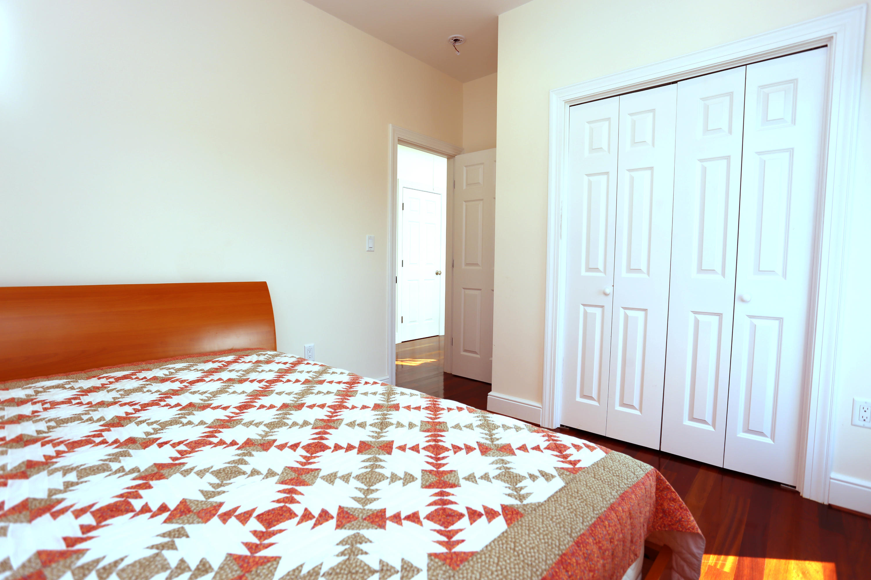 99 Phillips Road Sagamore Beach, MA 02562 - Photo 29 of 30 a bedroom with a bed and a lamp on dresser