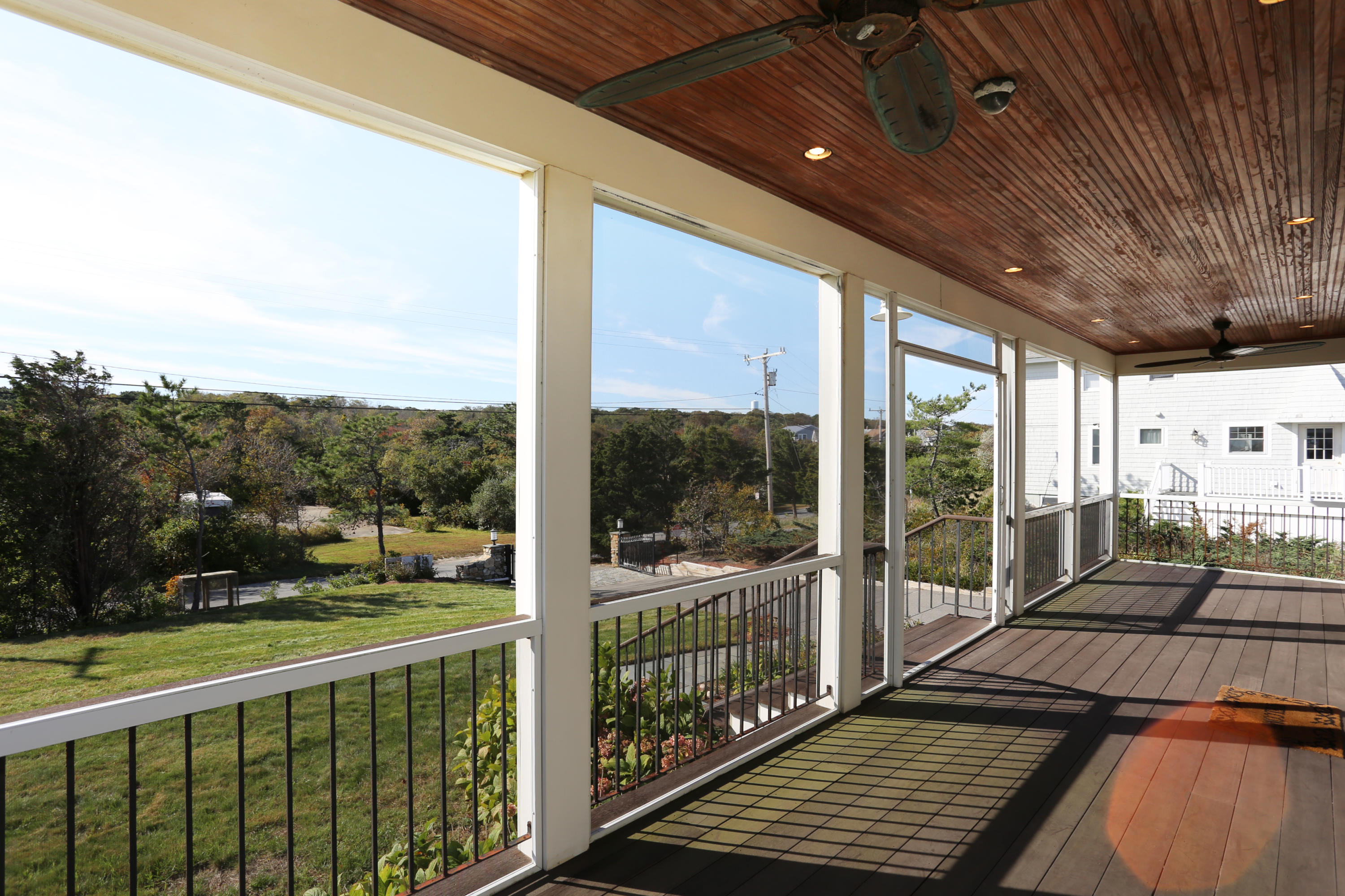99 Phillips Road Sagamore Beach, MA 02562 - Photo 4 of 30 a view of a balcony with wooden floor