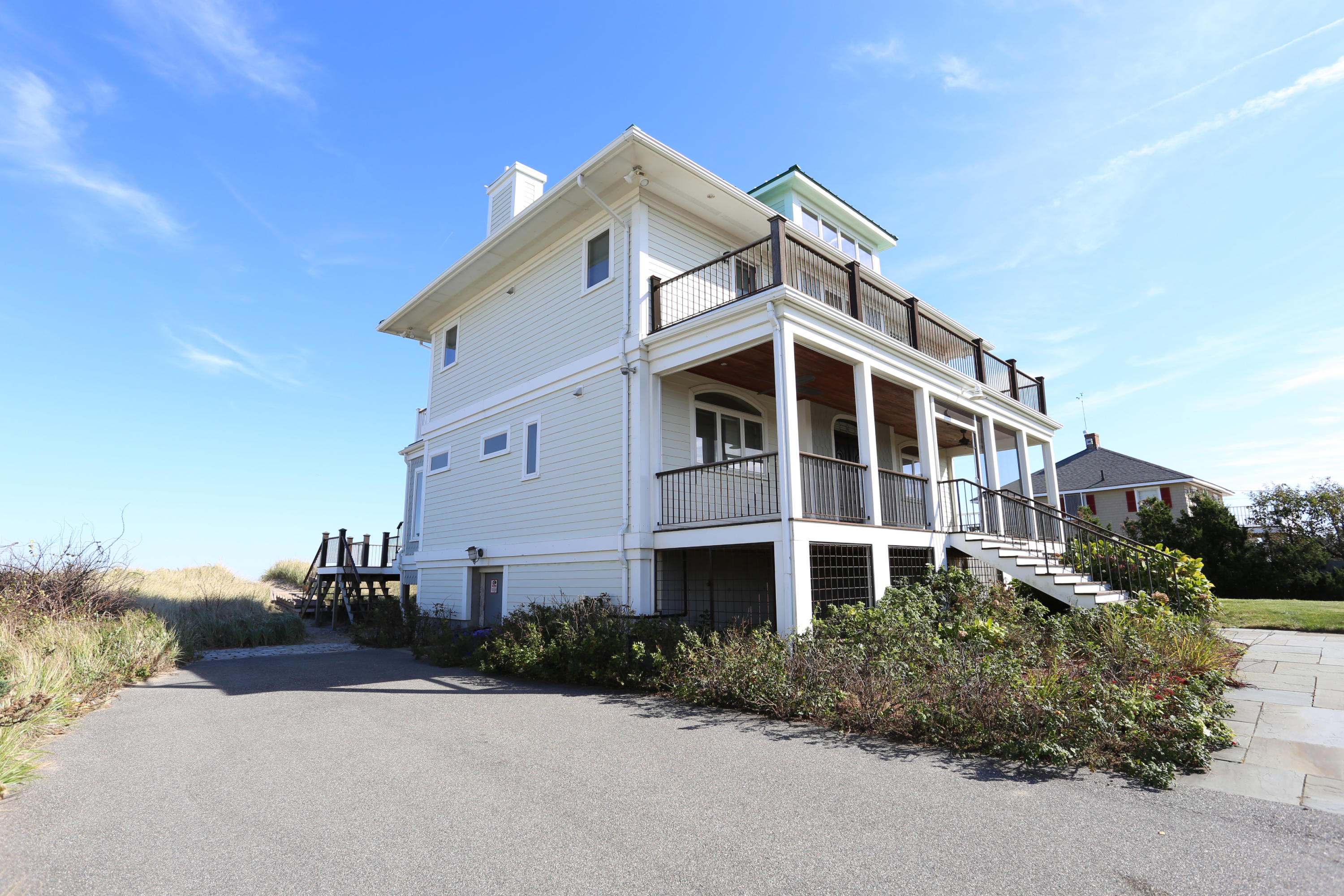 99 Phillips Road Sagamore Beach, MA 02562 - Photo 5 of 30 a front view of a house with a yard