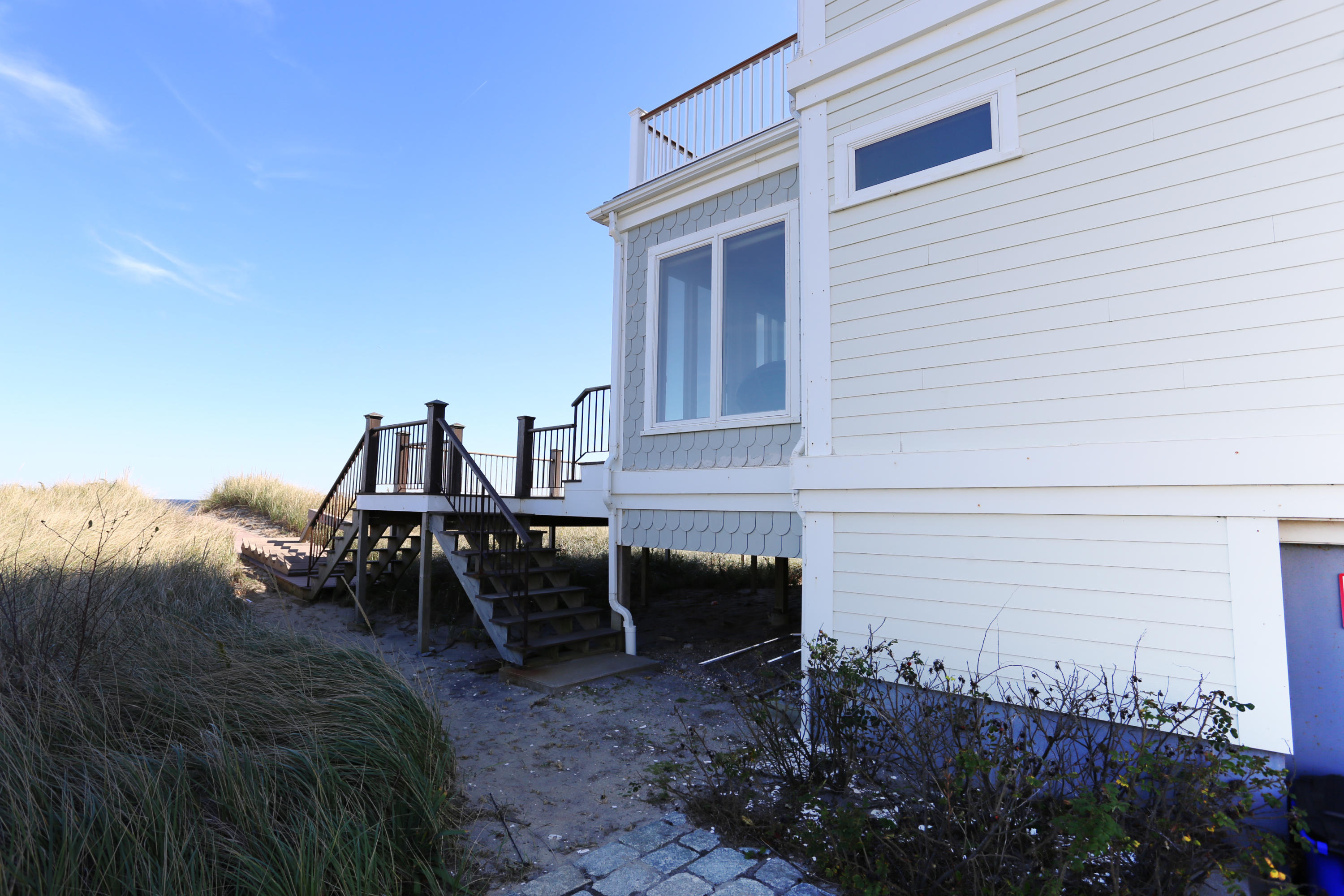 99 Phillips Road Sagamore Beach, MA 02562 - Photo 6 of 30 a view of a outdoor space with chairs