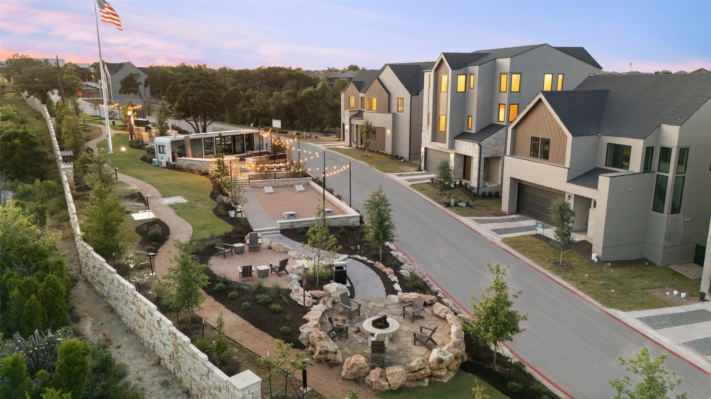 9803 Ribelin Ranch Court, Unit 6 Austin, TX 78750 - Photo 27 of 31 Modern residences with private outdoor spaces, community gathering areas, and landscaped grounds.