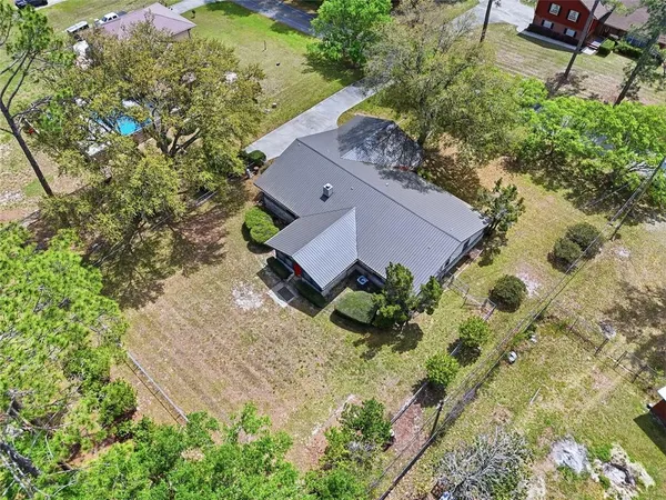 an aerial view of a house with a garden