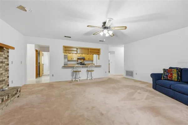 a view of a livingroom with a flat screen tv and couches