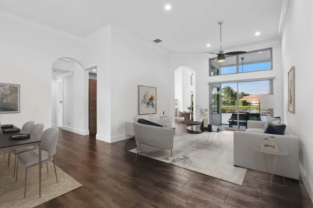 a view of a dining room with furniture and wooden floor