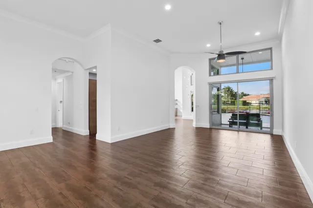 a view of an entryway with wooden floor
