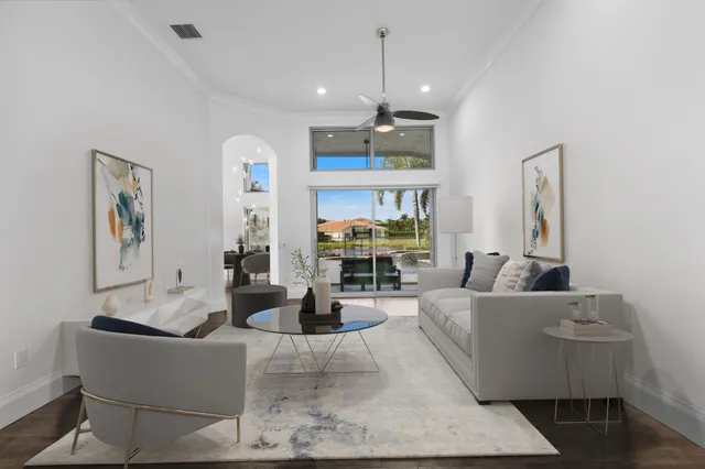 a view of a kitchen with furniture and a refrigerator