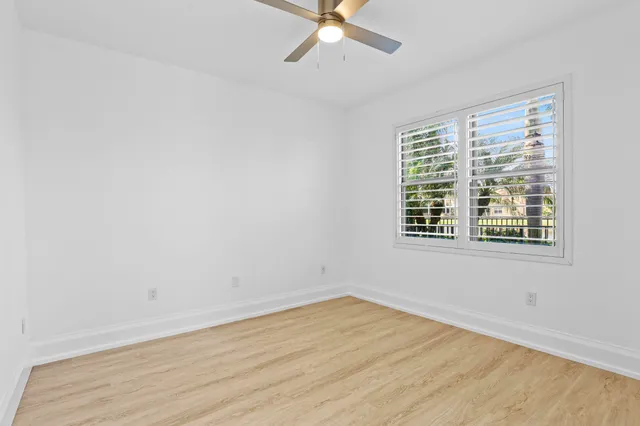 a view of a patio with couches table and chairs with potted plants