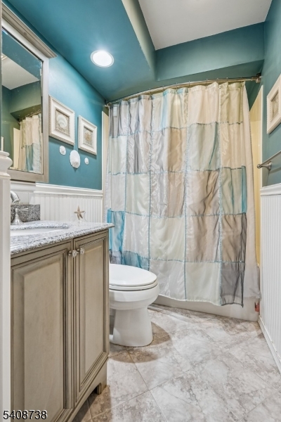 27 Espy Road, Unit A7 Caldwell, NJ 07006 - Photo 21 of 29 a bathroom with a granite countertop sink toilet and shower