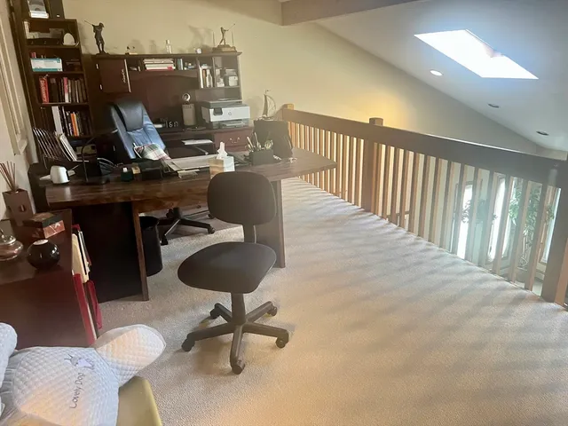 a bedroom with bed and window