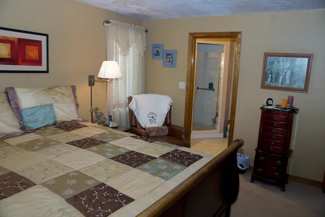 a bathroom with a shower and a sink