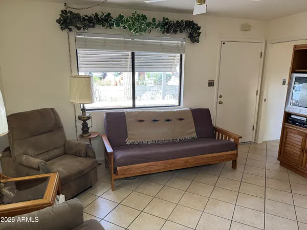 a living room with furniture and a large window