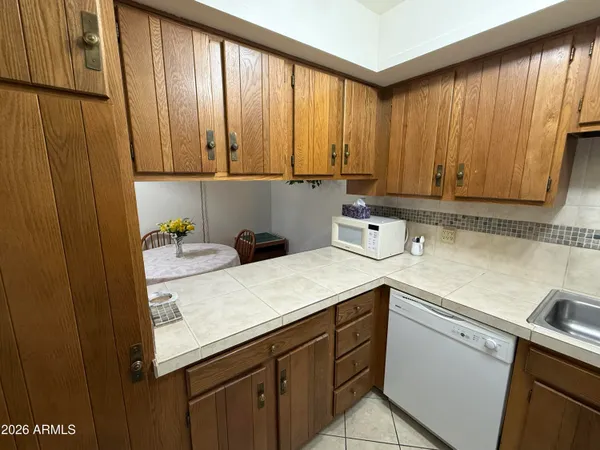 a room with a sink and cabinets